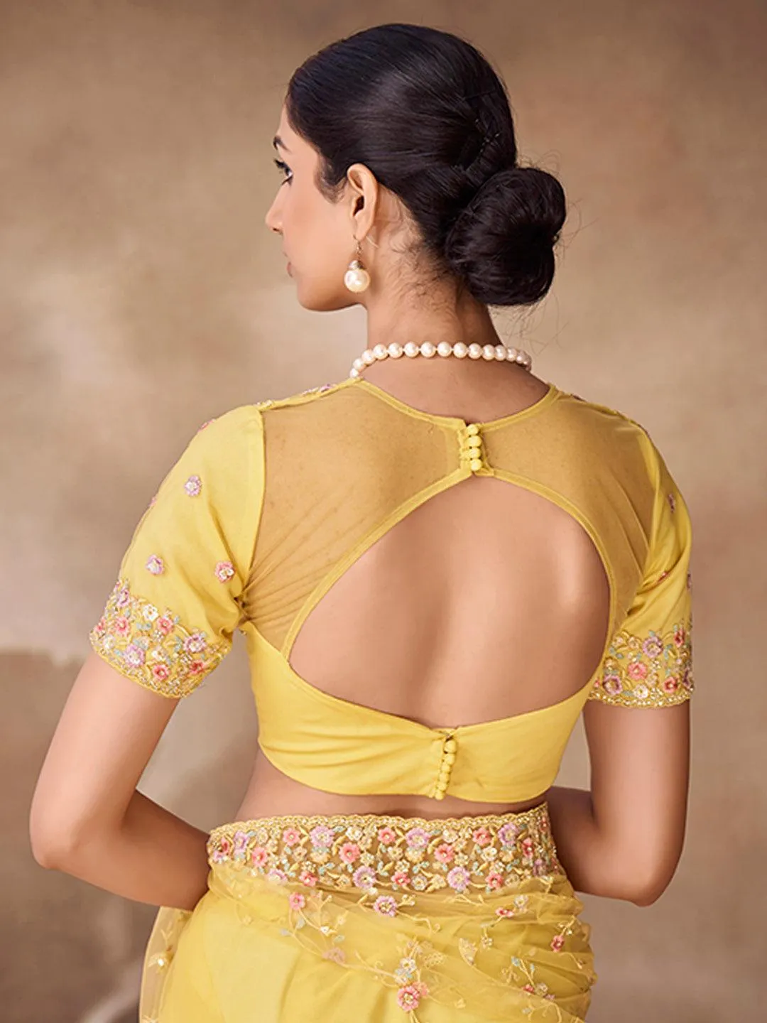 Yellow Net base embroidered and zarkan work saree